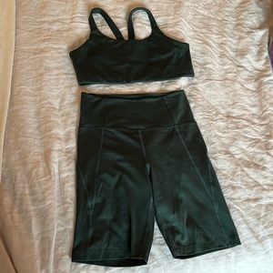 Girlfriend Collective High-Rise Bike Short and Lou V-Back Bra in moss/dark green